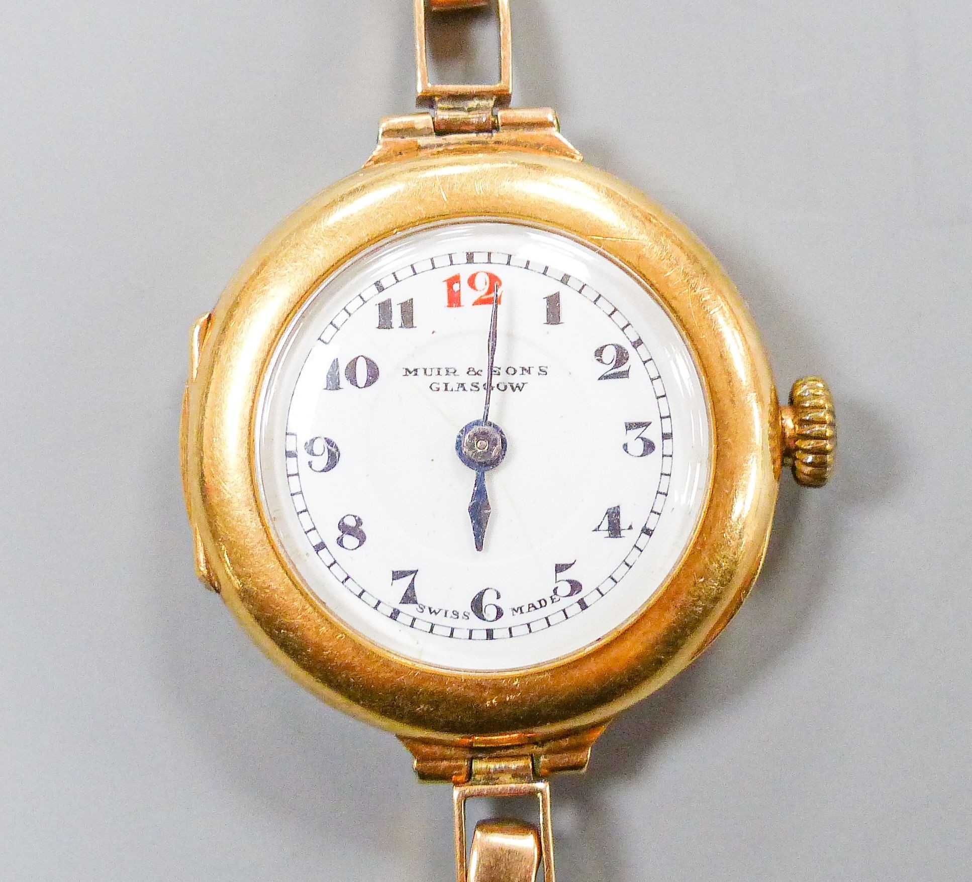 A lady's George V 18ct gold cased manual wind wrist watch, lacking bracelet, case hallmarked for Birmingham, 1917, retailed by Muir & Sons, Glasgow